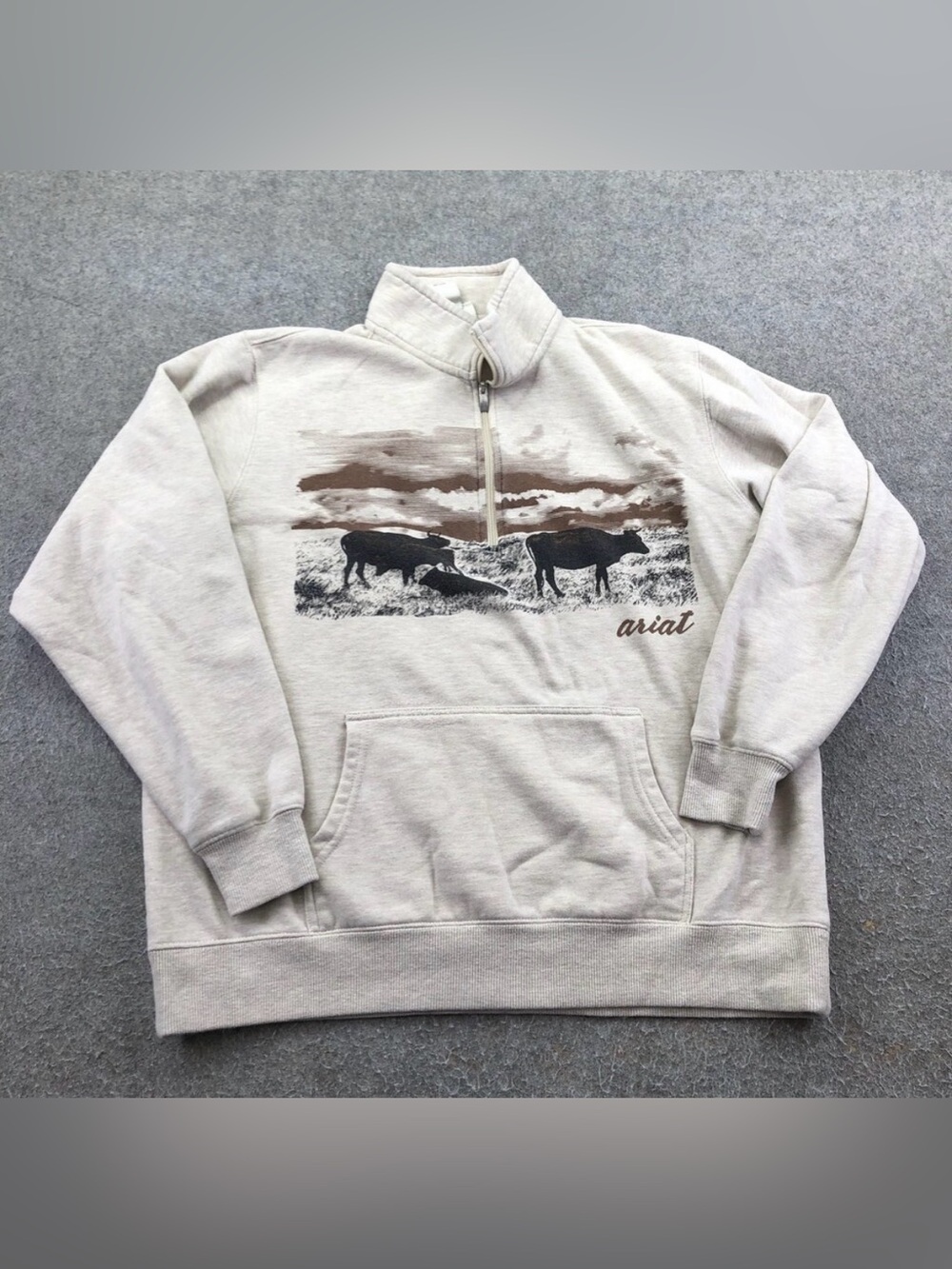 Ariat Woman’s Cream Zip-Up Sweatshirt with Brown & Black Ranch Cattle Graphic